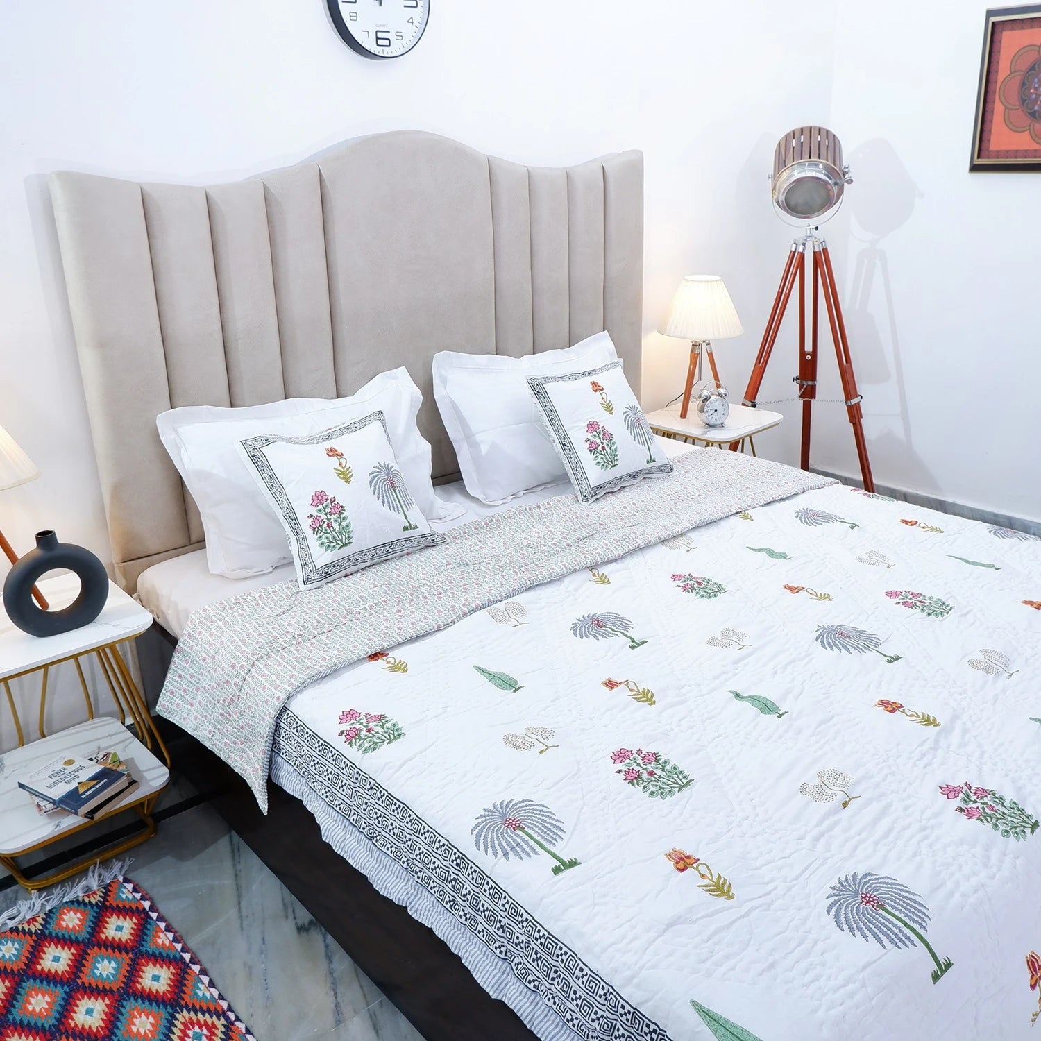 The Jaipuri 100% cotton double bed quilt featuring colorful floral patterns for a cozy bedroom design